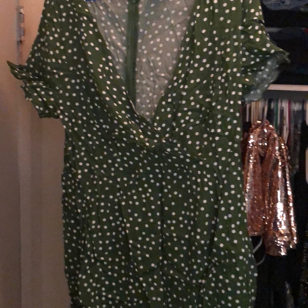 Green romper with white spots